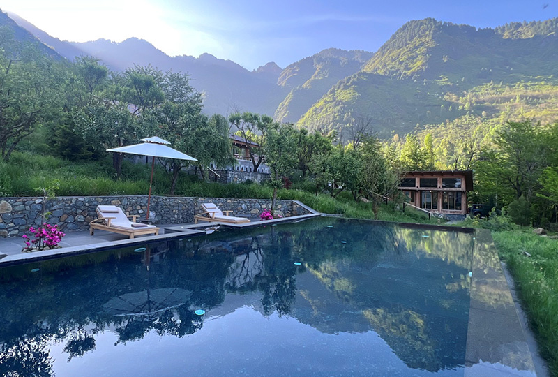 view of pool in mountain setting